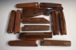 Eleven Beretta, Browning, Remington or similar chequered shotgun forends, one with metal fittings,
