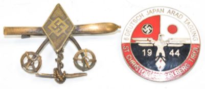 Two German Third Reich Nazi Hitler Youth badges, comprising ski/winter sports with ski poles and ice