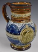 Doulton Lambeth Queen Victoria commemorative motto jug with hallmarked silver rim, signed to base,