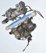 Two pairs of 1 1/2 inch SU carburettors together with a camshaft with Riley 4.72 written on covering