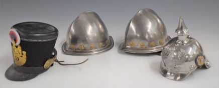 Four miniature military helmets, comprising French shako for 59th Regiment, Prussian pickelhaube and