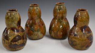 A set of four Royal Doulton Foliage Ware gourd vases decorated in the Autumn Leaves pattern, H15cm