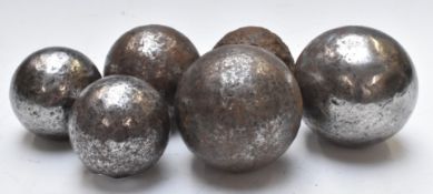 Six cannon balls of three different sizes, heaviest 6lb