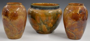 Royal Doulton Foliate Ware jardinière and a pair of vases, all decorated in the Autumn Leaves