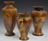 Three Royal Doulton Foliage Ware pedestal vases decorated in the Autumn Leaves pattern, tallest