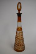 Stevens and Williams style flash overlaid intaglio cut glass decanter, 35cm tall.