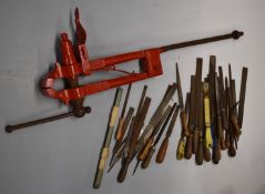 A large gunsmith's or similar vice with soft jaws together with a selection of woodworking files.