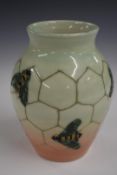 Dennis Chinaworks limited edition vase decorated with bees and honeycomb on a pale green and pink