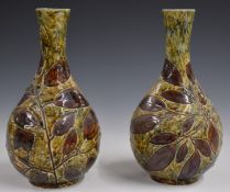 Pair of Royal Doulton Foliate Ware pedestal vases decorated in the Autumn Leaves pattern, H25cm