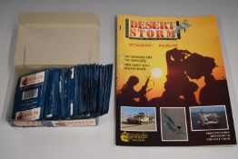 Desert Storm Heroes of the Gulf War sticker album and a box of stickers