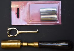 A 12 bore brass shotgun chamber brush with turned horn handle together with a 12 bore cartridge
