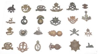 Twenty four British Army officer's collar badges including North Staffordshire Regiment,