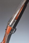 Sabel Gunmark 12 bore side by side shotgun with engraved locks and thumb lever, chequered grip and