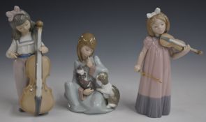 Three Lladro and Nao figures, tallest 20cm