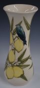 Moorcroft signed pedestal vase decorated in the Parrots and Lemons pattern, H31cm
