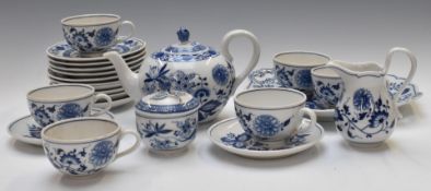 Twenty two pieces of Hutschenreuther tea ware decorated in the Onion pattern