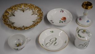 Meissen porcelain chocolate cup, cover and saucer, relief moulded plate and candlestick and a Berlin