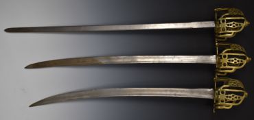 Three brass basket hilt swords, longest blade 77cm. PLEASE NOTE ALL BLADED ITEMS ARE SUBJECT TO OVER