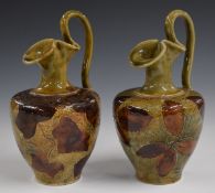 Pair of Royal Doulton Foliage Ware ewers decorated in the Autumn Leaves pattern, H21cm