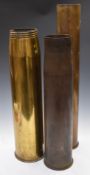 Three large brass shell cases, one dated 1961, another 105mm, tallest 74cm