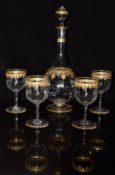 Baccarat c1890 wine decanter and four matching glasses with gilt and turquoise jewel decoration,
