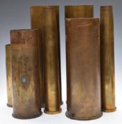 Seven Cold War brass shells including 105mm dated 1969 and 25 pounder dated 1955, tallest 37cm
