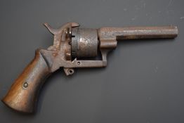 Belgian 7mm six-shot pin-fire revolver with shaped wooden grips and 3 inch octagonal barrel, overall