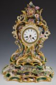 A 19th/20thC continental porcelain flower encrusted mantel clock and stand, H46cm