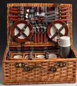 Wicker picnic hamper with contents including china plates and mugs, Thermos, cruet and cutlery