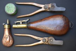 Two powder/ shot flasks one pistol flask with embossed decoration of an eagle, together with an F