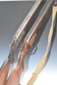 Two 12 bore side by side shotguns, one Belgian serial number 971 the other C G Bonehill serial