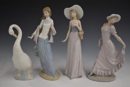 Three Nao figures and a swan, tallest 34cm