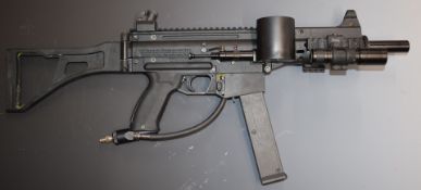 Tippmann assault rifle style paintball gun in carry case with a large quantity of parts and