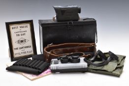 A collection of gun and shooting related items including 6x25 rangefinder etc in a black