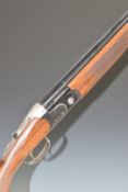 Beretta 686 Onyx 20 bore over and under ejector shotgun with named lock and underside, chequered