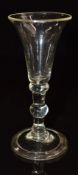An 18thC wine glass with flared bowl, doubled knopped stem and folded foot, 13cm tall.