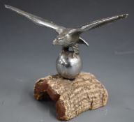 Desmo or similar car mascot formed as an eagle on a ball, wingspan 16.5cm