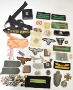 Replica German Nazi cloth and metal badges, cap tally, buttons etc