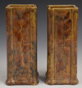 Pair of Royal Doulton Foliage Ware vases of square form decorated in the Autumn Leaves pattern,