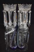 Pair of Victorian clear cut glass lustres 27cm tall and two Nailsea style blue glass canes, each