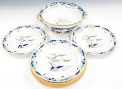 19thC Minton Aesthetic style bowl and nine plates decorated with cranes in flight above water,