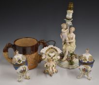 Continental figural candlestick, large salt glazed tankard with greyhound handles and a pair of