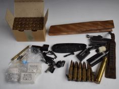 A collection of gun and shooting related items including used .303 brass rifle cartridges, sights,