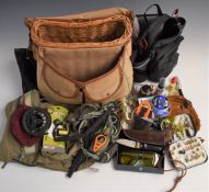 A canvas covered wicker creel with fly fishing reel, accessories box of flies etc