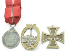 German Nazi Third Reich Iron Cross, Eastern Front badge and E Boat badge stamped SBW to reverse