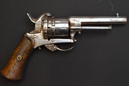 Belgian 7mm six-shot double-action pin-fire revolver with shaped wooden grips, folding trigger and