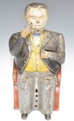 19thC style novelty cast iron 'banker' moneybox, with hinged hand to place the coins in his pocket