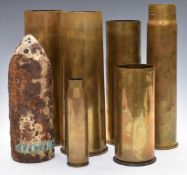 Six brass shell cases of differing sizes/calibres, tallest 30.5cm, together with shell / projectile