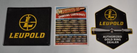 Three shop display advertising signs two Leupold and one Remington Sporting Cartridges, largest