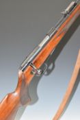 Walther .22 bolt-action rifle with chequered semi-pistol grip, raised cheek piece, two magazines,
